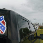 
              A pickup truck with a Confederate flag-themed decal is parked outside the Reception and Medical Center, the state's prison hospital where new inmates are processed, in Lake Butler, Fla., Friday, April 16, 2021. In 2013, at a prison dorm room in the facility, Warren Williams, a Black inmate who suffered from severe anxiety and depression, found himself in front of Thomas Driver, a white prison guard, after he lost his identification badge, a prison infraction. (AP Photo/David Goldman)
            