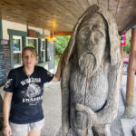 
              Pauline Bauer leans against a wooden statue outside Bob’s Trading Post, her restaurant in Hamilton, Pa., Wednesday, July 21, 2021. Bauer is one of more than 540 people charged with federal crimes stemming from the Jan. 6 riot at the U.S. Capitol. (AP Photo/Michael Kunzelman)
            
