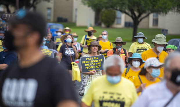 A group of people make a stop at Good Hope Church in Round Rock, Texas, Wednesday, July 28, 2021 du...