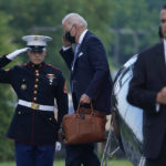 
              President Joe Biden walks off of Marine One at Walter Reed National Military Medical Center in Bethesda, Md., Thursday, July 29, 2021. Biden is there because first lady Jill Biden is having a procedure to remove an object that became lodged in her foot while walking on a Hawaiian beach earlier this week. (AP Photo/Susan Walsh)
            