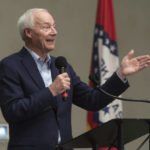 
              FILE - In this July 15, 2021, file photo, Arkansas Gov. Asa Hutchinson speaks during a town hall meeting in Texarkana, Ark. A group of Democratic lawmakers in Arkansas, which has the nation's highest COVID-19 rate, urged the governor and Republicans who control the Legislature on Thursday, Muly 22, 2021, to lift the state's ban on schools and government entities requiring people to wear masks. (Kelsi Brinkmeyer/The Texarkana Gazette via AP, File)
            