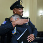 
              U.S. Capitol Police Sgt. Harry Dunn hugs Washington Metropolitan Police Department officer Michael Fanone after a House select committee hearing on the Jan. 6 attack on Capitol Hill in Washington, Tuesday, July 27, 2021. (Jim Bourg/Pool via AP)
            