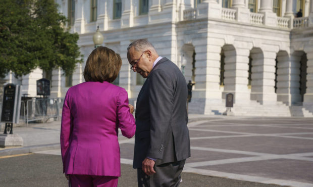 Speaker of the House Nancy Pelosi, D-Calif., left, and Senate Majority Leader Chuck Schumer, D-N.Y....