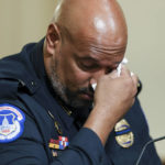 
              U.S. Capitol Police Sgt. Harry Dunn wipes his eye as he testifies during the House select committee hearing on the Jan. 6 attack on Capitol Hill in Washington, Tuesday, July 27, 2021. (Oliver Contreras/The New York Times via AP, Pool)
            