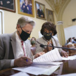 
              House Energy and Commerce Chairman Frank Pallone, D-N.J., left, and House Financial Services Committee Chairwoman Maxine Waters, D-Calif., go over their notes at the House Rules Committee as they prepare an emergency extension of the eviction moratorium, at the Capitol in Washington, Friday, July 30, 2021. President Joe Biden called on "Congress to extend the eviction moratorium to protect such vulnerable renters and their families without delay." (AP Photo/J. Scott Applewhite)
            