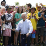 
              President Joe Biden poses for a photo after touring King Orchards fruit farm Saturday, July 3, 2021, in Central Lake, Mich. (AP Photo/Alex Brandon)
            