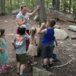 
              In this July 26, 2021 photo, Jennifer Briggs-Legere teaches a nature lesson to children at her A Place To Grow daycare center in Brentwood, N.H. Families are starting to spend the money from the expanded child tax credit, part of President Joe Biden's $1.9 trillion coronavirus relief package. Many say they are using the money to pay rent, supplement their grocery budgets and for catching up on bills, including cellphone and car payments. Biden increased the amounts going to families and has expanded it to include those whose income is so little they don't owe taxes. (AP Photo/Elise Amendola)
            