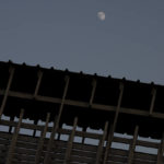 
              The moon rises over the Mughrabi Bridge, a wooden pedestrian bridge connecting the wall to the Al Aqsa Mosque compound, in Jerusalem's Old City, Tuesday, July 20, 2021. The rickety bridge allowing access to Jerusalem's most sensitive holy site is at risk of collapse, according to experts. But the flashpoint shrine's delicate position at ground-zero of the Israeli-Palestinian conflict has prevented its repair for more than a decade. (AP Photo/Maya Alleruzzo)
            