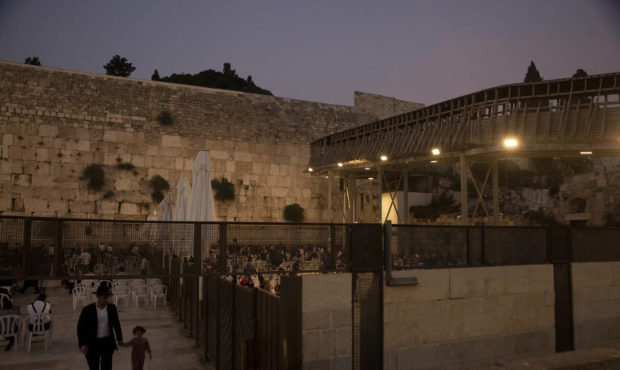 The wooden bridge, right, connecting the Western Wall, the holiest site where Jews can pray, to the...