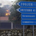 
              Fires rage through the countryside in Cuglieri, near Oristano, Sardinia, Italy, early Sunday, July 25, 2021. Hundreds of people were evacuated from their homes in many small towns in the province of Oristano, Sardinia, after raging fires burst in the areas of Montiferru and Bonarcado. (Alessandro Tocco/LaPresse via AP)
            