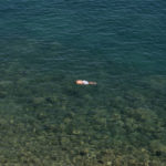 
              A man swims in the sea with a mask and snorkel at a beach of Vouliagmeni suburb, southwest of Athens, on Friday, July 30, 2021. Greek authorities ordered additional fire patrols and infrastructure maintenance inspections Friday as the country grappled with a heat wave expected to last more than a week, with temperatures expected to reach 42 C (107.6 F). (AP Photo/Yorgos Karahalis)
            