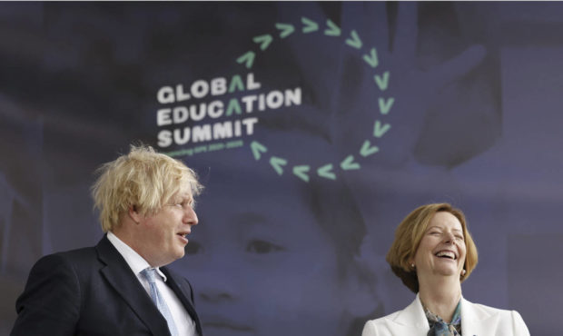 Britain's Prime Minister Boris Johnson alongside former PM of Australia Julia Gillard during a summ...
