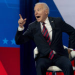 
              President Joe Biden interacts with members of the audience during a commercial break for a CNN town hall at Mount St. Joseph University in Cincinnati, Wednesday, July 21, 2021. (AP Photo/Andrew Harnik)
            