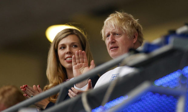 British Prime Minister Boris Johnson and his wife Carrie watch the Euro 2020 soccer championship fi...