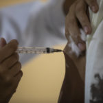
              A man gets a shot of the AstraZeneca vaccine for COVID-19 during a vaccination campaign for people over age 35 in Rio de Janeiro, Brazil, Friday, July 23, 2021. (AP Photo/Bruna Prado)
            