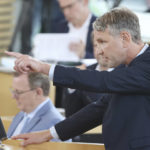 
              Bjoern Hoecke, parliamentary group leader of the AfD in the Thuringian state parliament, speaks before the vote in the plenary hall in Erfurt, Germany, July 23, 2021.  The far-right Alternative for Germany party failed in an attempt Friday to unseat the left-wing governor of an eastern German state, a long-shot bid that opponents denounced as political theater. (Bodo Schackow/dpa via AP)
            