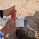 
              Paul "Paco" Ollerton flushes water valves at his farm near Casa Grande, Ariz., on Tuesday, July 20, 2021. Climate change, drought and high demand are expected to force the first-ever mandatory cuts from the Colorado River water supply, and Arizona farmers will be hit hardest. (AP Photo/Felicia Fonseca)
            