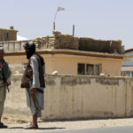 
              Taliban fighters stand guard inside the city of Ghazni, southwest of Kabul, Afghanistan, Friday, Aug. 13, 2021.  The Taliban have completed their sweep of the country’s south on Friday, as they took four more provincial capitals in a lightning offensive that is gradually encircling Kabul, just weeks before the U.S. is set to officially end its two-decade war.   (AP Photo/Gulabuddin Amiri)
            