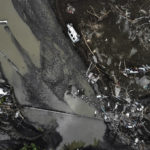 
              An aerial photo shows overturned cars among destruction in a mud-covered street in Bozkurt town of Kastamonu province, Turkey, Saturday, Aug. 14, 2021. The death toll from severe floods and mudslides in coastal Turkey has climbed to at least 40, the country's emergency and disaster agency said Saturday. Torrential rains that pounded the Black Sea provinces of Bartin, Kastamonu and Sinop on Wednesday caused flooding that demolished homes, severed at least five bridges, swept away cars and rendered numerous roads unpassable.(Ismail Coskun/IHA via AP)
            