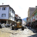 
              Workers clear the mud from a street in Bozkurt town of Kastamonu province, Turkey, Saturday, Aug. 14, 2021. The death toll from severe floods and mudslides in coastal Turkey has climbed to at least 44, the country's emergency and disaster agency said Saturday. Torrential rains that pounded the Black Sea provinces of Bartin, Kastamonu and Sinop on Wednesday caused flooding that demolished homes, severed at least five bridges, swept away cars and rendered numerous roads unpassable. (AP Photo)
            