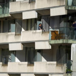 
              A couple take photos on a balcony of their inner city apartment in Sydney, Australia, on Aug. 14, 2021. Australia shut its borders to the world shortly after the pandemic erupted in 2020. Those lucky enough to be granted permission to travel must then spend two weeks quarantining in a hotel when they return, at their own expense, approximately US$2,400. Many have wondered what these quarantine hotels are like, and how those of us cloistered inside pass the time during those 14 days. (AP Photo/Mark Baker)
            