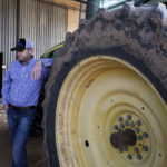 
              Will Thelander, a partner in his family’s farming business, talks about expected water shortages in Arizona that will impact his operation in Casa Grande, Ariz., Thursday, July 22, 2021. The Colorado River has been a go-to source of water for cities, tribes and farmers in the U.S. West for decades. But climate change, drought and increased demand are taking a toll. The U.S. Bureau of Reclamation is expected to declare the first-ever mandatory cuts from the river for 2022. (AP Photo/Darryl Webb)
            