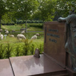 
              A statue on a grave overlooks grazing sheep at Schoonselhof cemetery in Hoboken, Belgium, Friday, Aug. 13, 2021. More than 100 sheep have been set out in one of Antwerp's most historical cemeteries to graze, increasing the biodiversity and reducing the need for noisy and sometimes destructive lawnmowers. (AP Photo/Virginia Mayo)
            