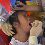 
              A child reacts as she gets a swab during the third-round of coronavirus test at a residential block in Wuhan city in central China's Hubei province, Wednesday, Aug. 11, 2021. The World Health Organization says it will soon test three drugs used for other diseases to see if they might help patients sickened by the coronavirus. (Chinatopix Via AP)
            