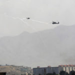 
              Anti-missile decoy flares are deployed as U.S. Black Hawk military helicopters fly over the city of Kabul, Afghanistan, Sunday, Aug. 15, 2021. Taliban fighters entered the outskirts of the Afghan capital on Sunday and said they were awaiting a “peaceful transfer” of the city after promising not to take it by force, but amid the uncertainty panicked workers fled government offices and helicopters landed at the U.S. Embassy. (AP Photo/Rahmat Gul)
            