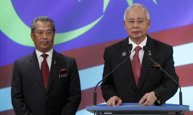 FILE - In this May 15, 2013, file photo, Malaysian Prime Minister Najib Razak, right, speaks during...