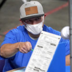 
              FILE - In this May 6, 2021 file photo, Maricopa County ballots cast in the 2020 general election are examined and recounted by contractors working for Florida-based company, Cyber Ninjas at Veterans Memorial Coliseum in Phoenix. On Friday, Aug. 6, 2021, The Associated Press reported on stories circulating online incorrectly asserting a state-by-state analysis of votes for President Joe Biden in the 2020 election suggests there was election fraud. But the report, which based its claims on assumptions related to voting and registration trends, provided no proof of fraud. (AP Photo/Matt York, Pool)
            