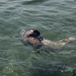 
              A person swims in the sea at a beach of Kavouri suburb, southwest of Athens, on Friday, July 30, 2021. Greek authorities ordered additional fire patrols and infrastructure maintenance inspections Friday as the country grappled with a heat wave expected to last more than a week, with temperatures expected to reach 42 C (107.6 F). (AP Photo/Yorgos Karahalis)
            