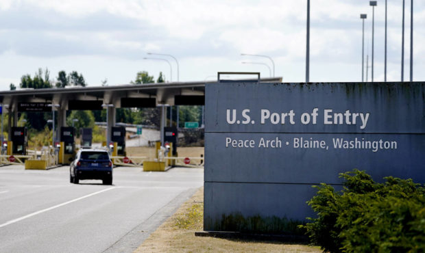 A single vehicle heads into the U.S. at the quiet Peace Arch border crossing Monday, Aug. 9, 2021, ...