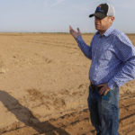 
              Will Thelander, a fourth-generation farmer, talks about having to leave fields unplanted as less water from the Colorado River makes it to his farm in Casa Grande, Ariz., Thursday July 22, 2021. The Colorado River has been a go-to source of water for cities, tribes and farmers in the U.S. West for decades. But climate change, drought and increased demand are taking a toll. The U.S. Bureau of Reclamation is expected to declare the first-ever mandatory cuts from the river for 2022. (AP Photo/Darryl Webb)
            
