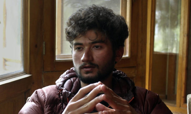 Pakistani mountain climber Shehroz Kashif, 19, gives an interview to The Associated Press, in Skard...