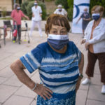 
              Hipolita, 96, takes part in a dance class at the Orpea Buenavista nursing home in Madrid, Spain, Thursday, Aug. 12, 2021. Once almost all of the elderly have been vaccinated, some residences are resuming some of the activities they organized before COVID, but maintaining a safe distance and wearing masks. (AP Photo/Andrea Comas)
            