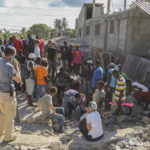 
              People search for survivors in the debris of a home destroyed by the earthquake in Les Cayes, Haiti, Saturday, Aug. 14, 2021. A 7.2 magnitude earthquake struck Haiti on Saturday, with the epicenter about 125 kilometers (78 miles) west of the capital of Port-au-Prince, the US Geological Survey said. (AP Photo/Joseph Odelyn)
            