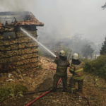 
              Firefighters water to stop a fire in the fire-devastating Sirtkoy village, near Manavgat, Antalya, Turkey, Sunday, Aug. 1, 2021. More than 100 wildfires have been brought under control in Turkey, according to officials. The forestry minister tweeted that five fires are continuing in the tourist destinations of Antalya and Mugla. (AP Photo)
            