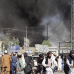 
              Smoke rises after fighting between the Taliban and Afghan security personnel in the city of Kandahar, southwest of Kabul, Afghanistan, Thursday, Aug. 12, 2021. (AP Photo/Sidiqullah Khan)
            