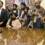 
              Taliban fighters take control of Afghan presidential palace after the Afghan President Ashraf Ghani fled the country, in Kabul, Afghanistan, Sunday, Aug. 15, 2021. (AP Photo/Zabi Karimi)
            