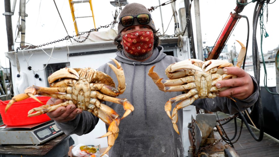Fisherman Mike Vorak sells Dungeness crabs off his boat. (Jane Tyska/Digital First Media/Getty Imag...