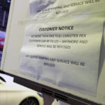 
              An information sign related to the current outbreak of fuel panic buying is seen at a petrol station in Manchester, England, Monday, Sept. 27, 2021. British Prime Minister Boris Johnson is said to be considering whether to call in the army to deliver fuel to petrol stations as pumps ran dry after days of panic buying. ( AP Photo/Jon Super)
            