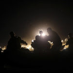 
              United States agents rescue a migrant child from the waters of the Rio Grande after her parents lost their footing and their children began to be swept away by the current on the American side of the border between Ciudad Acuna, Mexico, and Del Rio, Texas Thursday, Sept. 23, 2021. . (AP Photo/Felix Marquez)
            