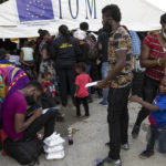 
              Haitian migrants deported from the US register after arriving to the Toussaint Louverture International Airport in Port-au-Prince, Haiti, Sunday, Sept. 19, 2021. Thousands of Haitian migrants have been arriving to Del Rio, Texas, to ask for asylum in the U.S., as authorities begin to deported them to back to Haiti. (AP Photo/Rodrigo Abd)
            