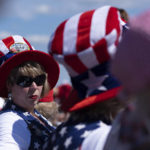 
              Tonia Garrett sports a flag hat while waiting with friends for the start of former president Donald Trump's Save America rally in Perry, Ga., on Saturday, Sept. 25, 2021. (AP Photo/Ben Gray)
            