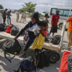 
              Haitians who were deported from the United States arrive at the Toussaint Louverture International Airport, in Port au Prince, Haiti, Sunday, Sep. 19, 2021. Thousands of Haitian migrants have been arriving to Del Rio, Texas, to ask for asylum in the U.S., as authorities begin to deported them to back to Haiti. (AP Photo/Joseph Odelyn)
            