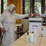 
              A nun casts her ballot for the abortion referendum at a polling station in San Marino, Sunday, Sept. 26, 2021. Tiny San Marino is one of the last countries in Europe which forbids abortion in any circumstance — a ban that dates from 1865. Its citizens are voting Sunday in a referendum calling for abortion to be made legal in the first 12 weeks of pregnancy. (AP Photo/Antonio Calanni)
            