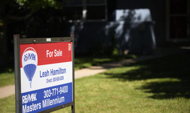 A sale sign stands outside a home on the market Tuesday, Sept. 21, 2021, in southeast Denver. The N...