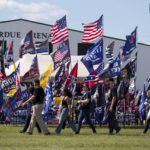 
              Supporters file into the Georgia National Fairgrounds in Perry, Ga., to attend former president Donald Trump's "Save America" rally Saturday, Sept. 25, 2021. (AP Photo/Ben Gray)
            