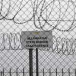 
              FILE - In this Monday, April 8, 2019 file photo, a sign reading: "State Border" is attached to a fence at Hungary's border with Serbia near the village Asotthalom, Hungary. When Hungary and Poland joined the European Union in 2004, after decades of Communist domination, they thirsted for Western democratic standards and prosperity yet, 17 years later, as the EU ramps up efforts to rein in democratic backsliding in both countries, some of the governing right-wing populists in Hungary and Poland are comparing the bloc to their former Soviet oppressors — and flirting with the prospect of exiting the bloc. (AP Photo/Darko Vojinovic, File)
            